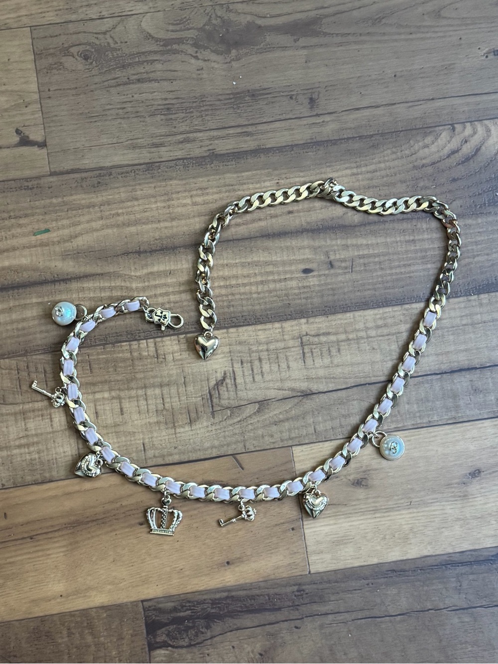 Juicy Couture Gold Tone Charm Necklace with Pale Pink Ribbon